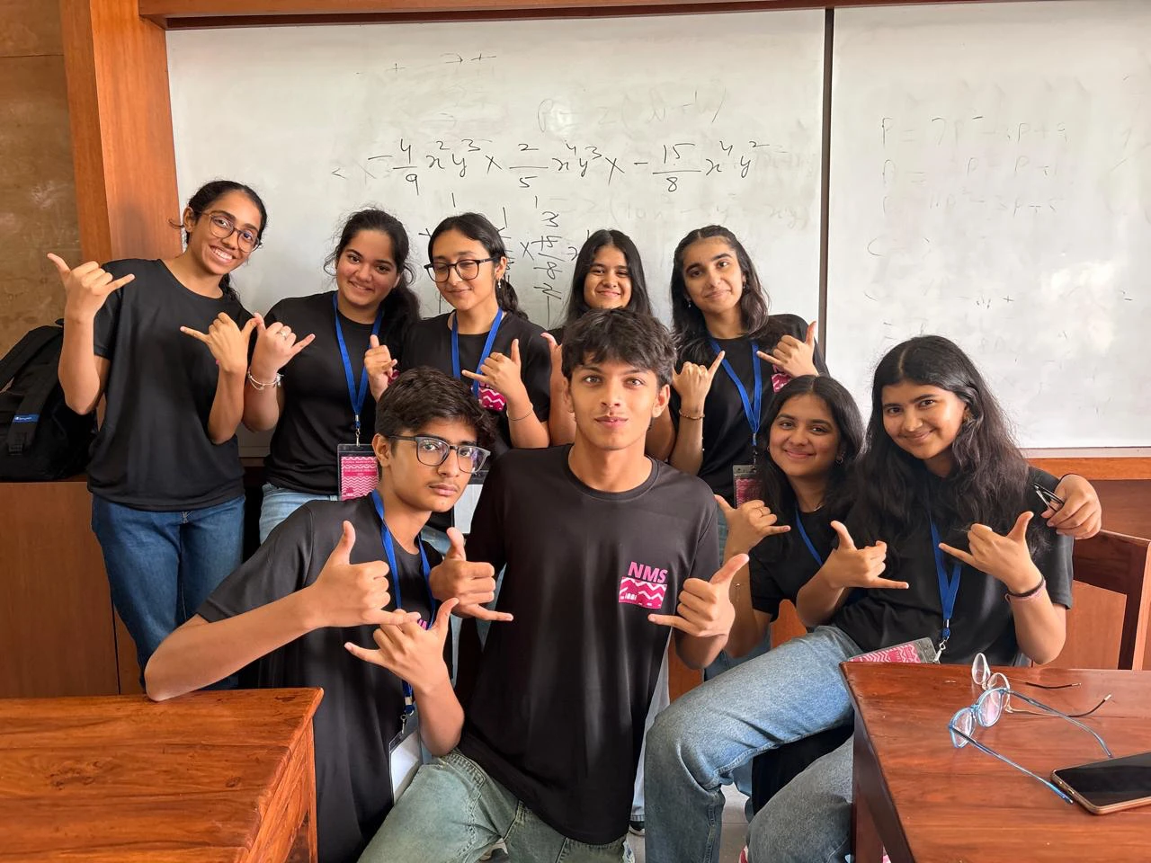 Aarav, front centre, with the Jaipur Debate editorial team in matching black T-shirts in front of a whiteboard